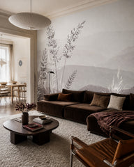 Calm mountains and grass wallpaper in a designer living room.