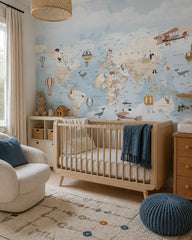 Vintage explorer world map, animals & airships mural in a modern nursery with a crib.