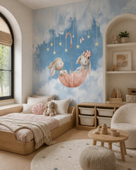 Bunnies in umbrella wallpaper in a toddler bedroom with a child-sized bed.