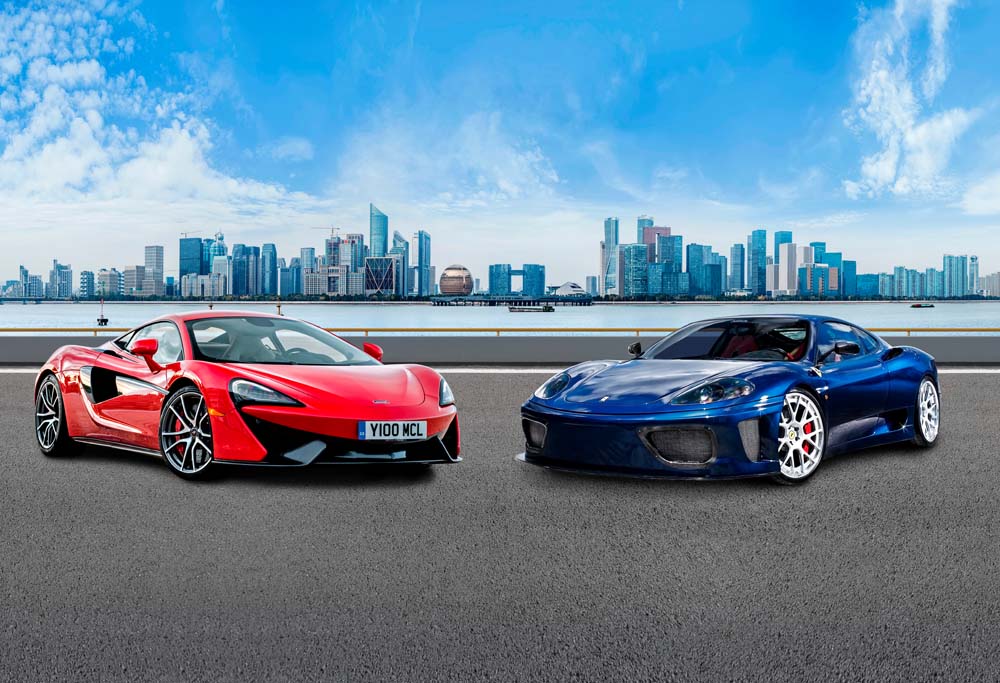 Dynamic Supercars on Urban Waterfront - Red McLaren and Blue Ferrari Against City Skyline Wall Mural