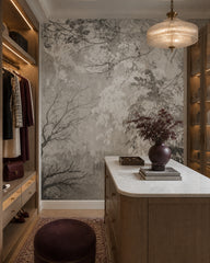 Grey leaves and branches wallpaper in a dressing room.