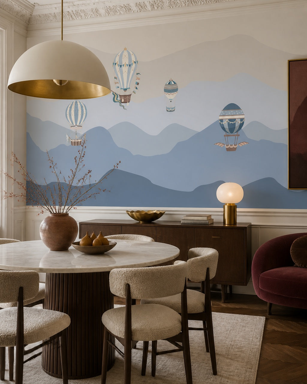 Vintage balloons over blue mountains wallpaper in a refined dining area.