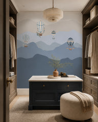 Vintage balloons over blue mountains wallpaper in a dressing room.