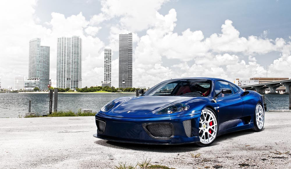 Modern Sports Car with City Skyline Wall Mural Wallpaper - Blue Ferrari in Urban Setting