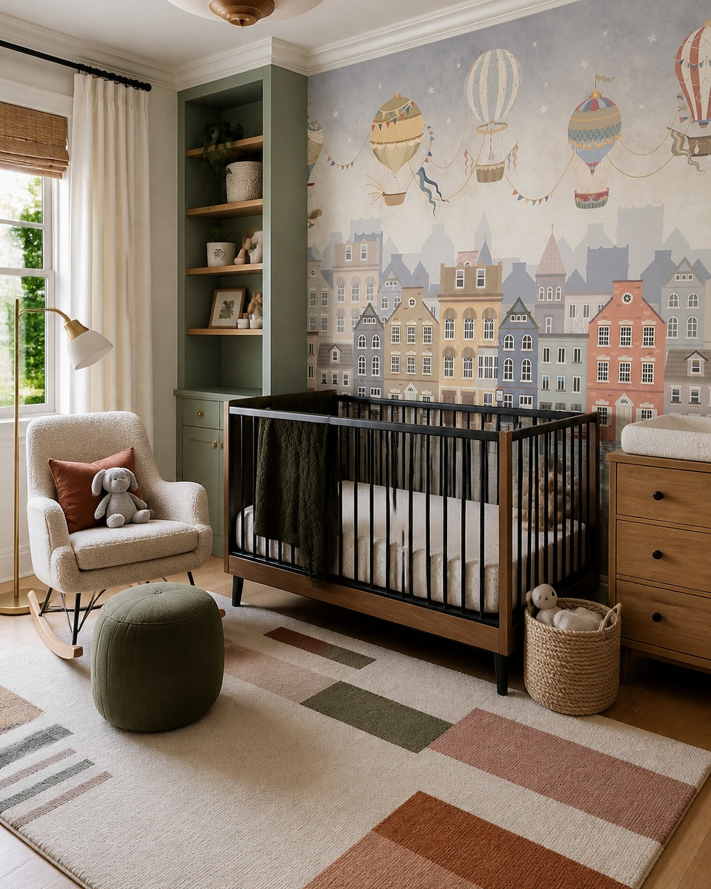Vintage balloon adventures kids room wallpaper in a modern nursery with a crib.