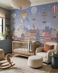 Vintage balloons over the twilight town wallpaper in a modern nursery with a crib.