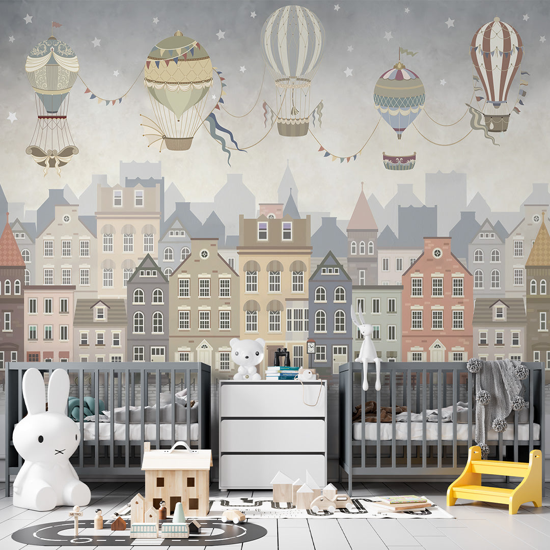 Vintage kids room wallpaper with ornate hot-air balloons and stars floating above a pastel European-style town.