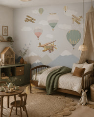 Vintage airplanes and balloons kids room wallpaper in a girl’s bedroom.