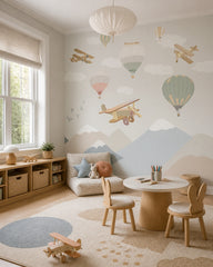 Vintage airplanes and balloons kids room wallpaper in a children’s playroom.