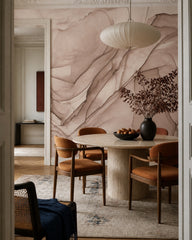 Dusty rose alcohol ink abstract wall mural in a refined dining area.