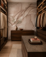 Dusty rose alcohol ink abstract wall mural in a walk-in wardrobe.