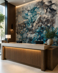 Ocean blue & rose gold alcohol ink wall mural at a hotel reception desk.
