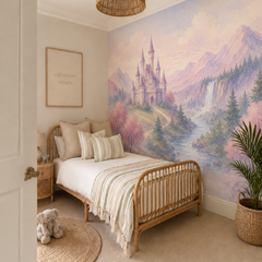 Pastel fantasy castle wallpaper displayed behind a children’s daybed with lavender accents, mountains and waterfall.