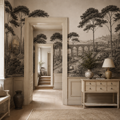 Black and white Italian landscape wallpaper in a classic entryway with open doorways.