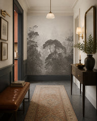 Misty grey forest wallpaper in an architectural hallway.