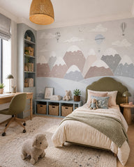 Dreamy balloons above snowy mountains nursery wallpaper in a girl’s bedroom.