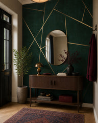 Gold lines on emerald wallpaper in a refined foyer.
