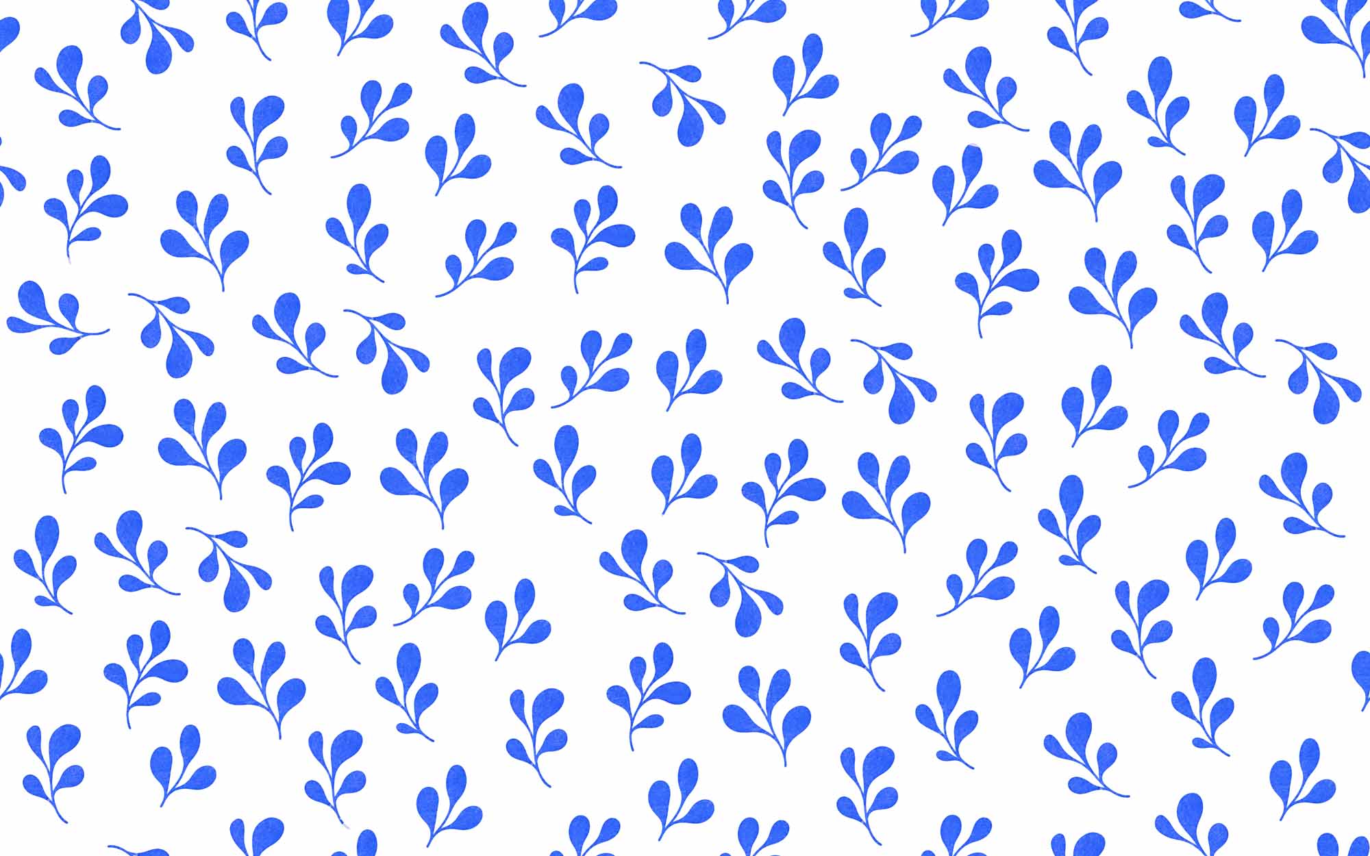 Repeating cobalt blue leaf wallpaper pattern on a warm cream background.