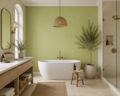 Pistachio green textured wallpaper in a spa bathroom with freestanding tub.