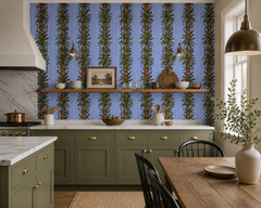 Blue stripe botanical wallpaper in a kitchen with sage green cabinets and open shelf.