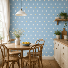 Powder blue daisy wallpaper in a cottage kitchen with round wooden table and bentwood chairs.