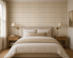 Cream tile effect wallpaper in a calm neutral bedroom with wall sconces.