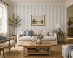 Blue and cream stripe wallpaper in a coastal living room with white sofa.