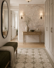 Blush almond blossom wallpaper in a refined foyer.