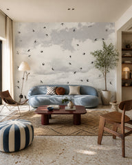 Swallows in flight wallpaper in a designer living room.