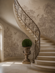 Vintage botanical wall mural with trees and birds installed around a classic fireplace in a traditional interior.