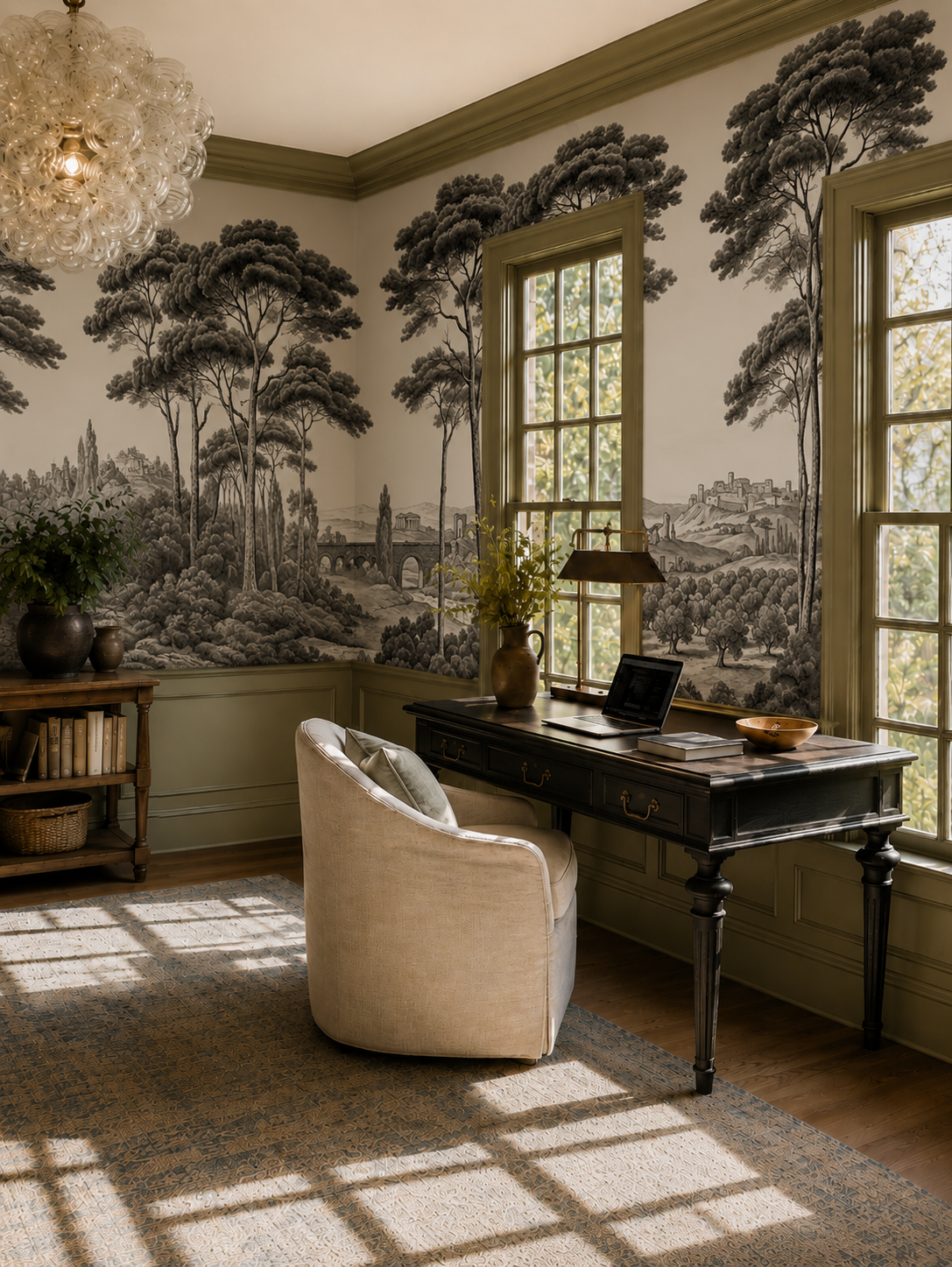 Black and white Italian toile wallpaper in a study with olive green trim and antique desk.