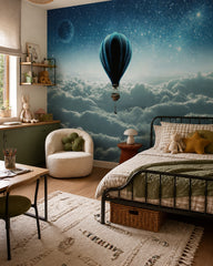 Hot air balloon above clouds wallpaper in a girl’s bedroom.