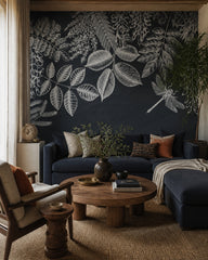 Chalkboard botanical wallpaper in a designer living room.
