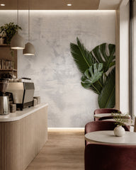 Monstera leaf wallpaper in a specialty coffee shop.