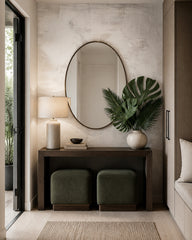 Monstera leaf wallpaper in a refined foyer.