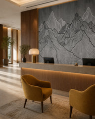 Line art mountains wallpaper at a hotel reception desk.