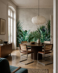 Banana leaf jungle wallpaper in a refined dining area.