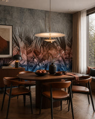 Pink and blue palm leaves wallpaper in a refined dining area.