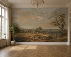 Classic pastoral landscape wall mural in oil painting style with wide sky, trees, village and grazing cattle in an empty room.