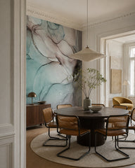 Teal ink wash wallpaper in a refined dining area.