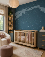 Milky Way wallpaper in a modern nursery with a crib.