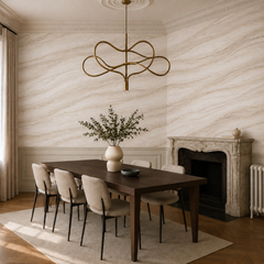 Ivory stone texture wallpaper shown in a classic dining room with dark wood table, fireplace and brass chandelier.