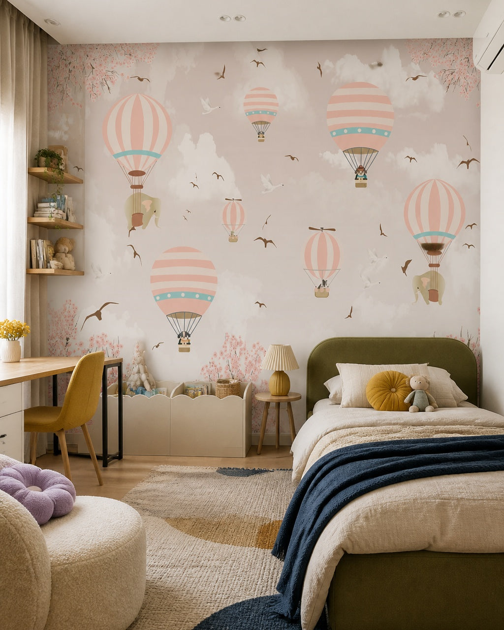 Pink sky hot air balloons wallpaper in a girl’s bedroom.