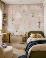 Pink sky hot air balloons wallpaper in a girl’s bedroom.