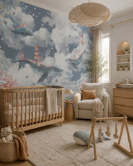 Whales in the clouds wallpaper in a modern nursery with a crib.