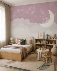 Pink moon, clouds & twinkling stars nursery wall mural in a toddler bedroom with a child-sized bed.