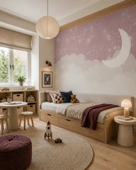 Pink moon, clouds & twinkling stars nursery wall mural in a boy’s bedroom.