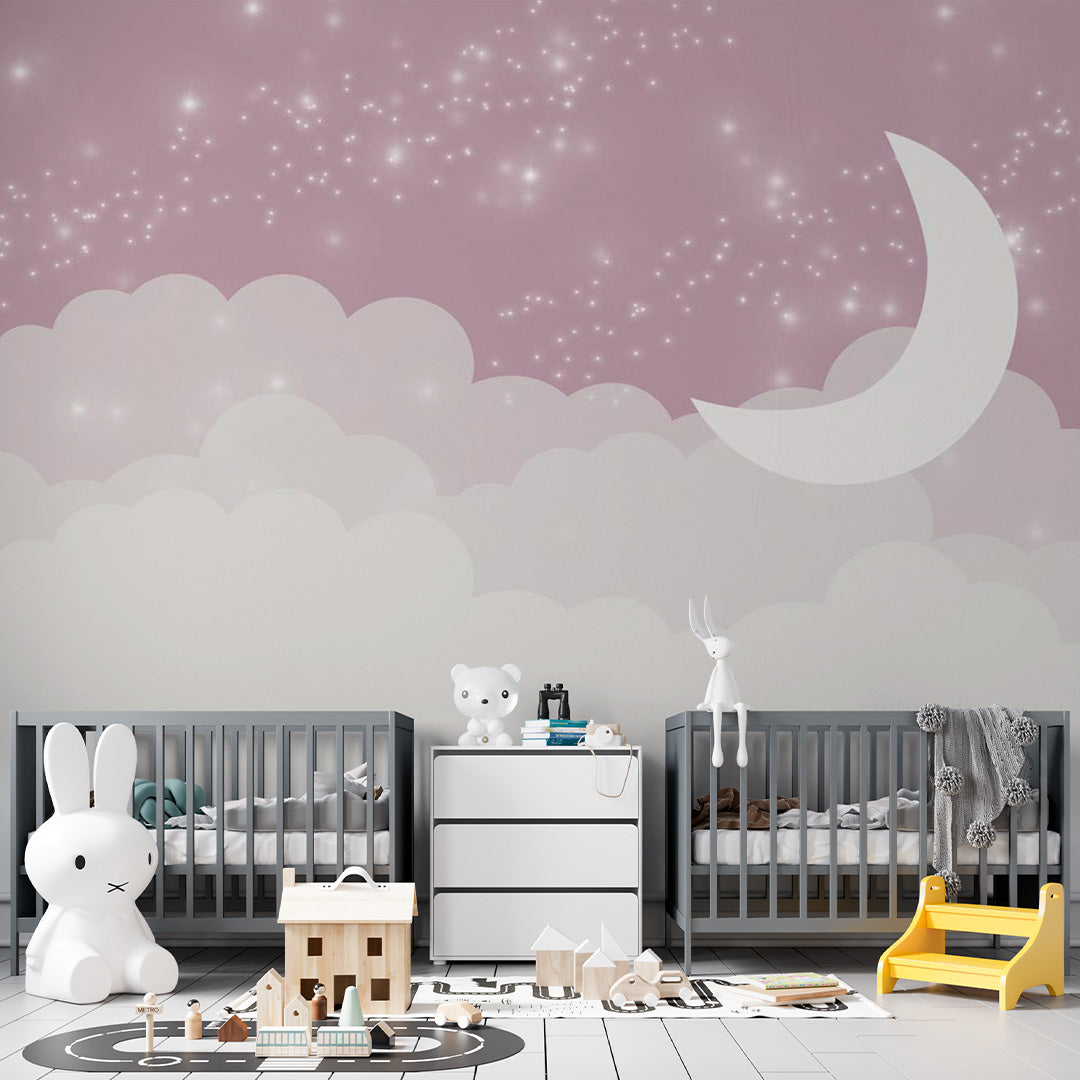 Pink celestial nursery wall mural with white crescent moon, soft clouds and twinkling stars