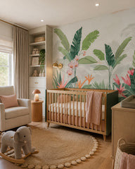 Tropical oasis wallpaper in a modern nursery with a crib.