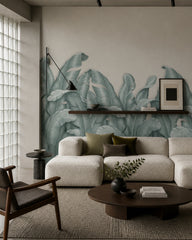 Sage banana leaves wallpaper in a designer living room.